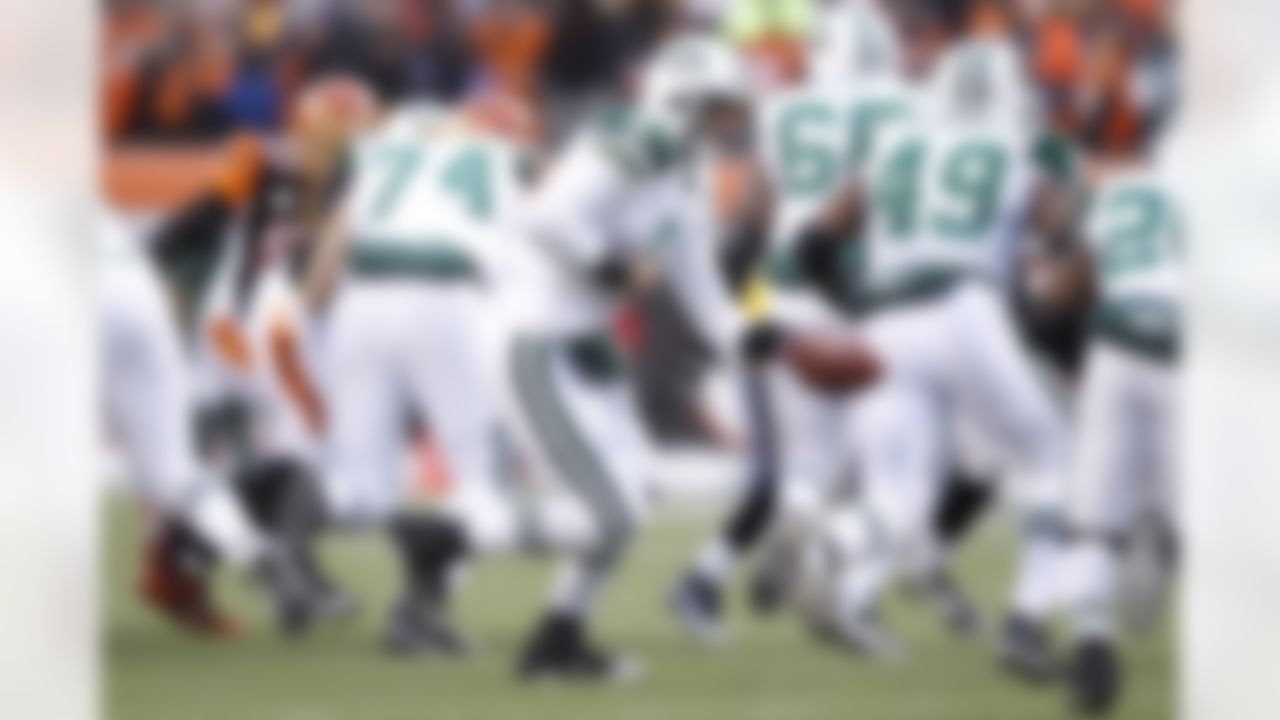 New York Jets quarterback Mark Sanchez (6) hands off the football against the Cincinnati Bengals during the AFC Wild Card Playoff game at Paul Brown Stadium in Cincinnati, Ohio on January 9, 2010. The Jets won 24-14. (Joe Robbins/NFL.com)