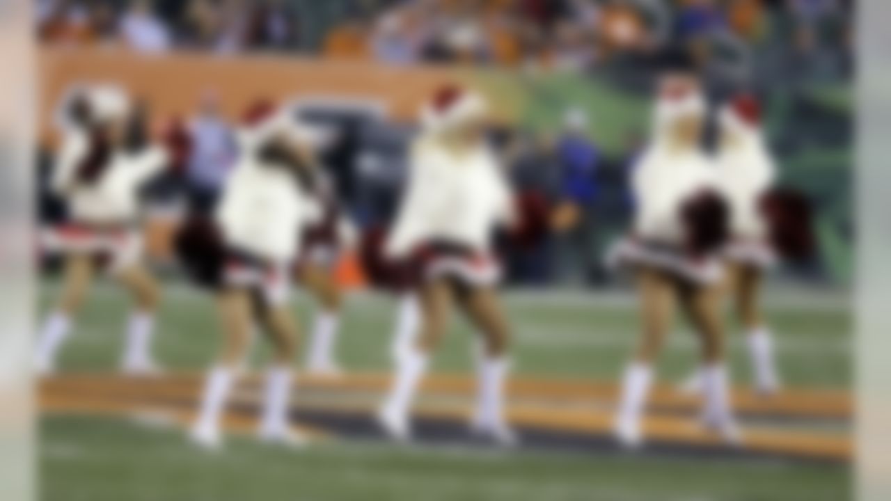 The Cincinnati Bengals cheerleaders perform before the start of an NFL football game between the Cincinnati Bengals and the Denver Broncos Monday, Dec. 22, 2014, in Cincinnati. (AP Photo/Michael Conroy)