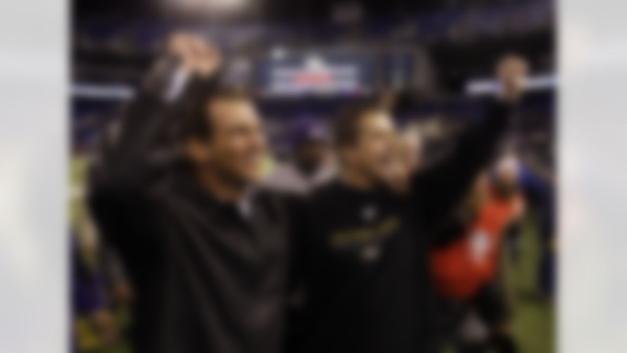 Baltimore Ravens owner Steve Bisciotti, left, and coach John Harbaugh celebrate after the Ravens defeated the Jacksonville Jaguars 27-7 in an NFL football game, Sunday, Dec. 28, 2008, in Baltimore. The Ravens advanced to the playoffs with the win. (AP Photo/Rob Carr)