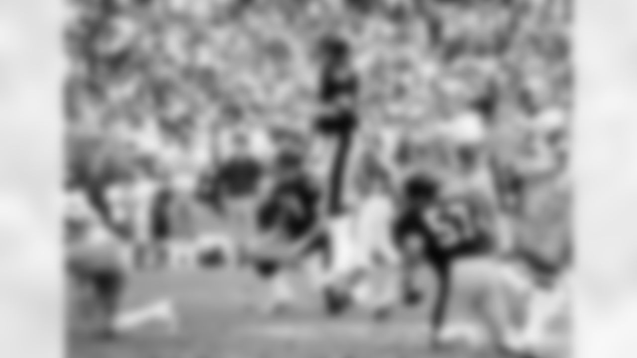 Pittsburgh Steelers quarterback Terry Bradshaw goes up in the air to watch his pass during the XIII Super Bowl against the Dallas Cowboys, in Miami, Fla., on January 21, 1979. Looking on are his teammates Ray Pinney (74) and Sam Davis (57). The Steelers defeated the Dallas Cowboys 35-31 to win the title. (AP Photo/Kathy Willens)