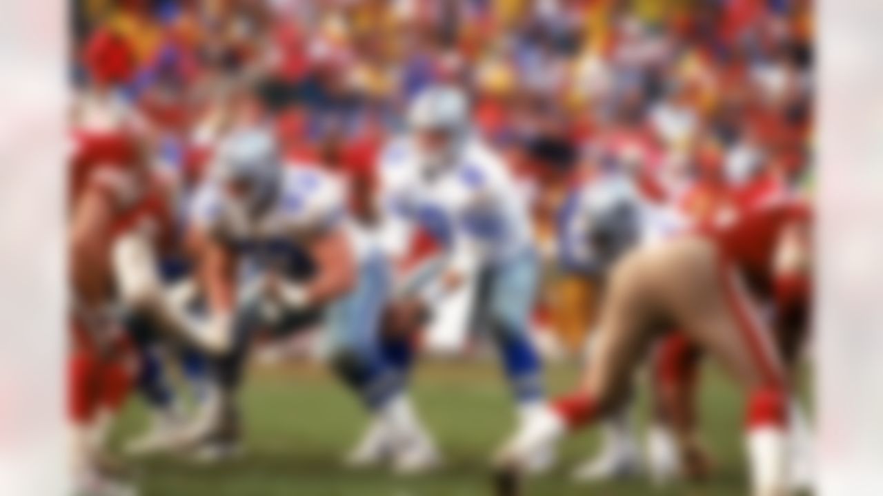 Quarterback Troy Aikman of the Dallas Cowboys #8 takes the snap from center Mark Stepnoski #53 against the San Francisco 49ers in the 1992 NFC Championship Game at Candlestick Park on January 17, 1993 in San Francisco, California. The Cowboys defeated the 49ers 30-20. (James Smith/NFL)