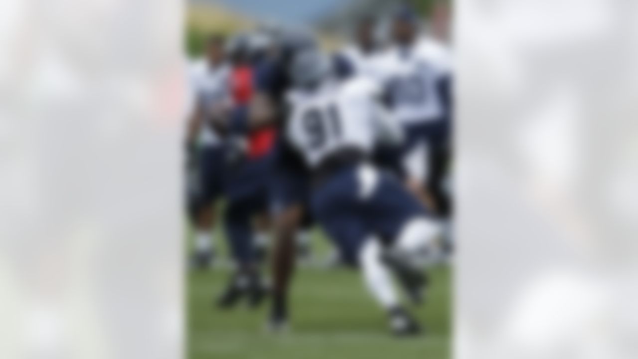 Seattle Seahawks' defensive end Chris Clemons (91) goes up against tackle Alex Barron during practice drills, Monday, July 30, 2012, at NFL football training camp in Renton, Wash. (AP Photo/Ted S. Warren)