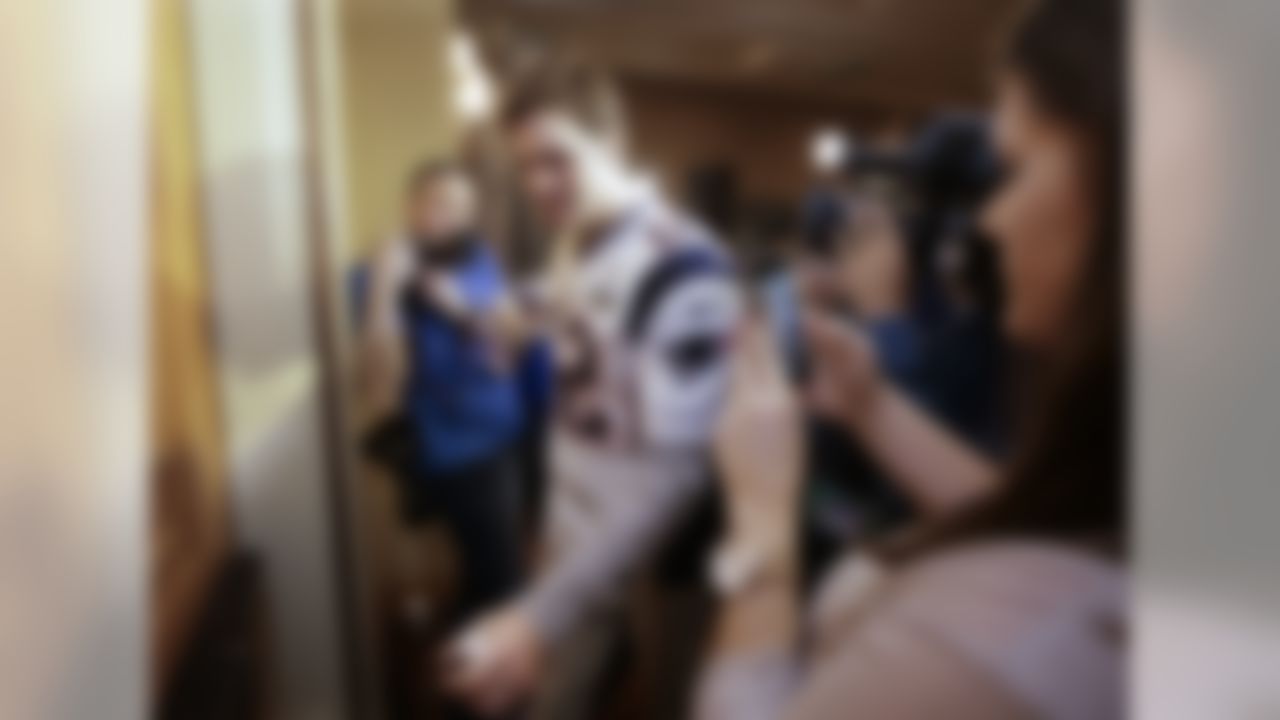 New England Patriots quarterback Tom Brady (12) leaves at the end of a news conference Wednesday, Jan. 28, 2015, in Chandler, Ariz. The Patriots play the Seattle Seahawks in NFL football Super Bowl XLIX Sunday, Feb. 1, in Phoenix. (AP Photo/Mark Humphrey)