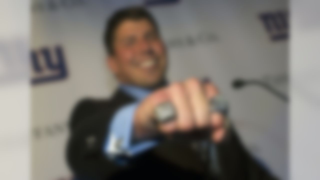 New York Giants offensive lineman David Diehl poses with his Super Bowl XLVI ring at Tiffany&Co., Wednesday, May 16, 2012, in New York. The Giants defeated the New England Patriots 21-17 in NFL football's Super Bowl XLVI to attain their fourth championship in franchise history. (AP Photo/John Minchillo)