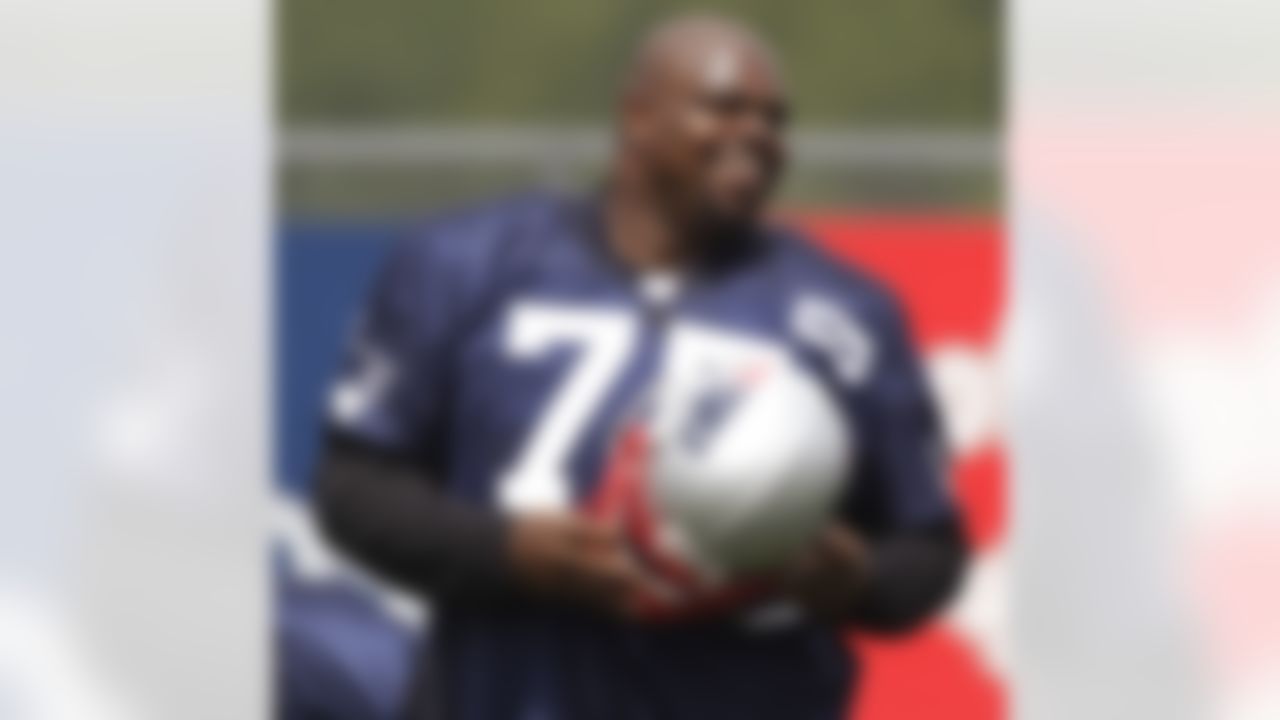 New England Patriots nose tackle Vince Wilfork smiles as he walks between drills during practice on the second day of NFL football training camp in Foxborough, Mass., Friday, July 27, 2012. (AP Photo/Stephan Savoia)