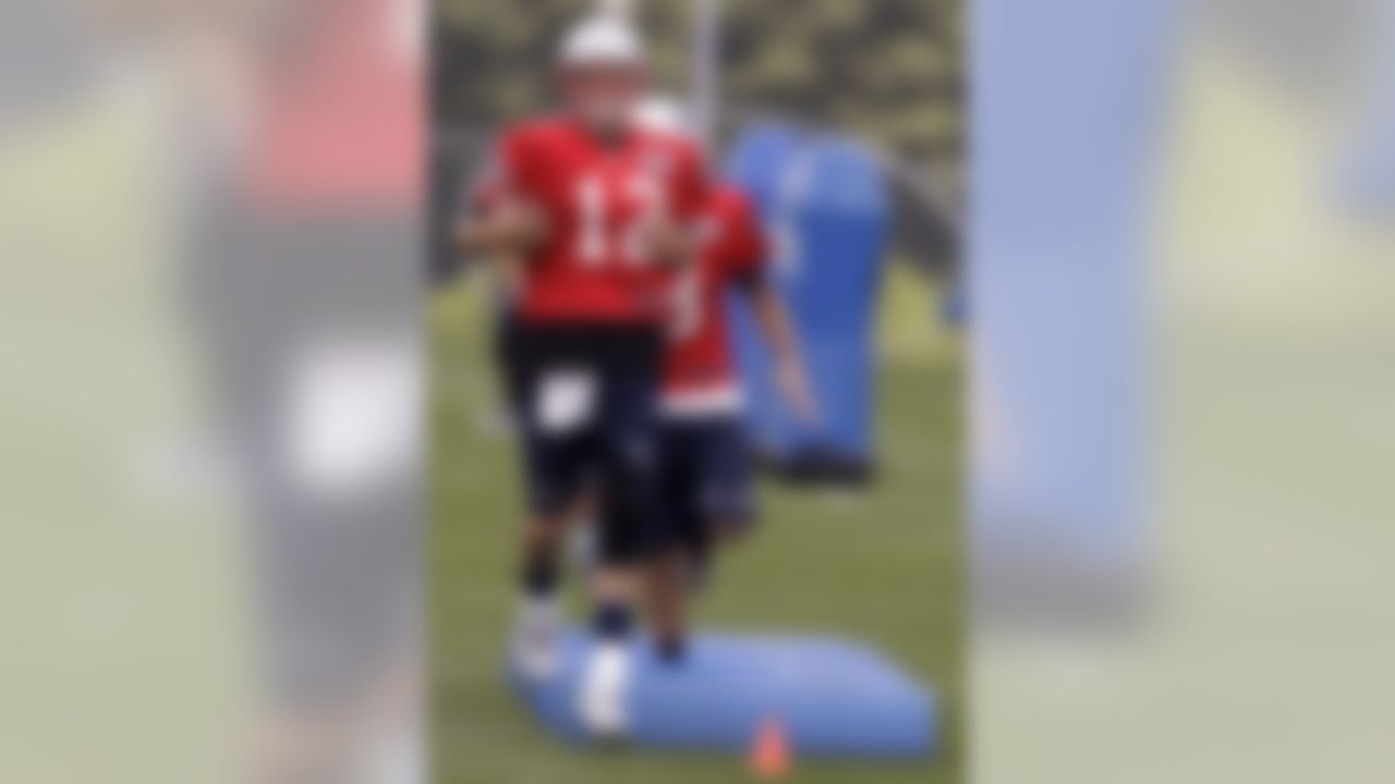 New England Patriots quarterback Tom Brady (12) runs a drill at practice during NFL football training camp in Foxborough, Mass., Thursday, Aug. 2, 2012. (AP Photo/Stephan Savoia)