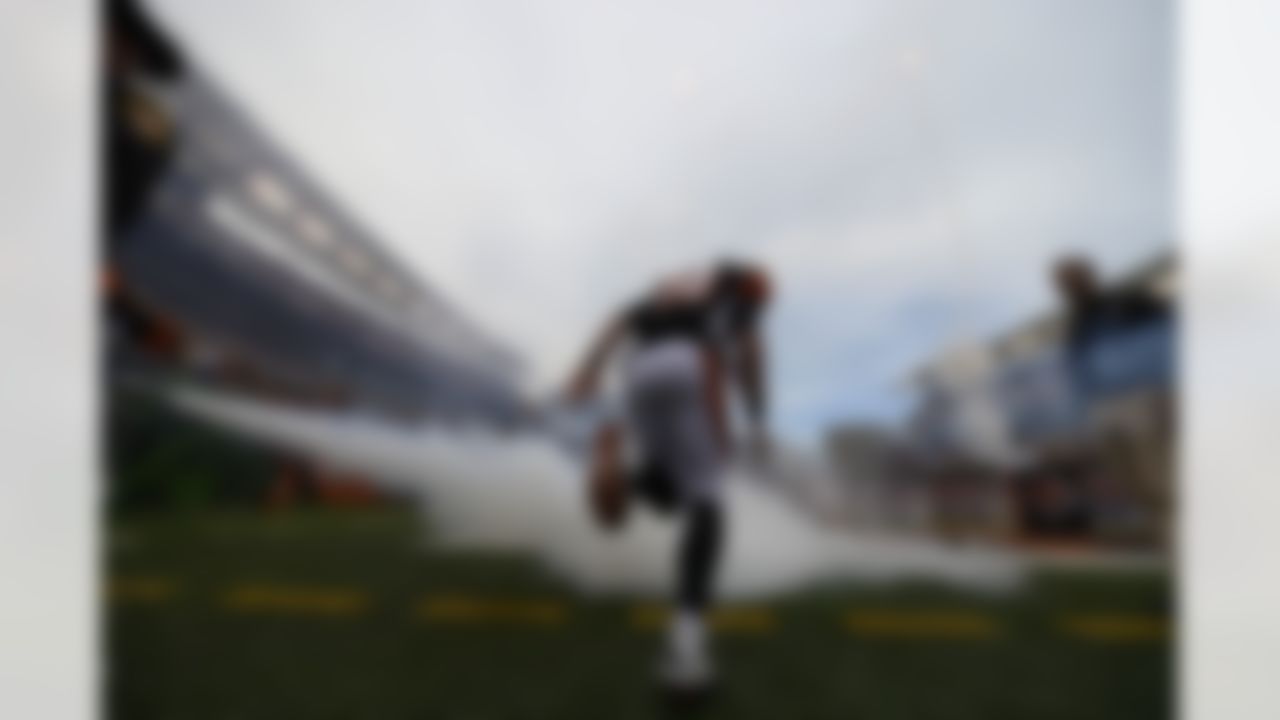 Cincinnati Bengals quarterback Andy Dalton (14) runs onto the field at the start of an NFL football game against the New York Giants, Sunday, Nov. 11, 2012, in Cincinnati. (AP Photo/Michael Keating)