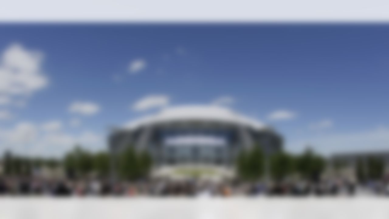 People gather before a ribbon cutting ceremony for the new at Cowboys Stadium home of the Dallas Cowboys football team, Wednesday, May 27, 2009, in Arlington, Texas. (AP Photo/Matt Slocum)