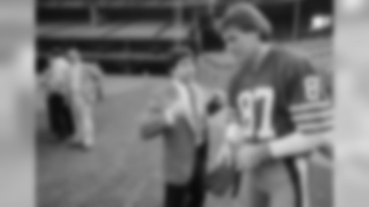 San Francisco 49ers wide receiver Dwight Clark (87) listens to a few words from 49ers owner Eddie DeBartolo Jr., before picture day in San Francisco, Jan. 16, 1985. Since De Bartolo bought the losing team seven years ago, it has won the division championship three times, won the Super Bowl once and is now going for a second Super Bowl victory. (AP Photo/Jeff Reinking)