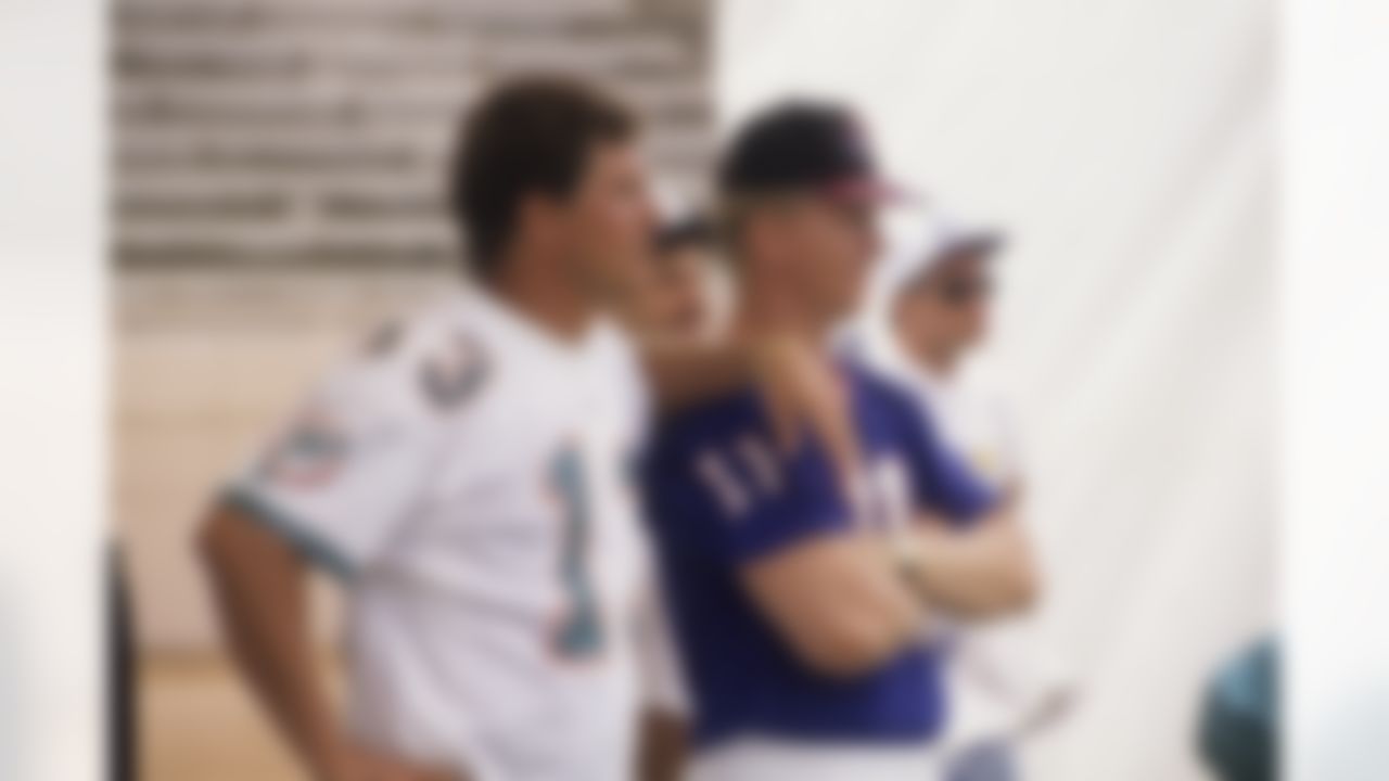 ORLANDO, FL - APRIL 17: Quarterbacks Dan Marino #13 of the Miami Dolphins and Phil Simms #11 of the New York Giants watch the 1992 Quarterback Challenge at Disney World in Orlando, Florida on April 17, 1992 in Orlando, Florida. (National Football League)
