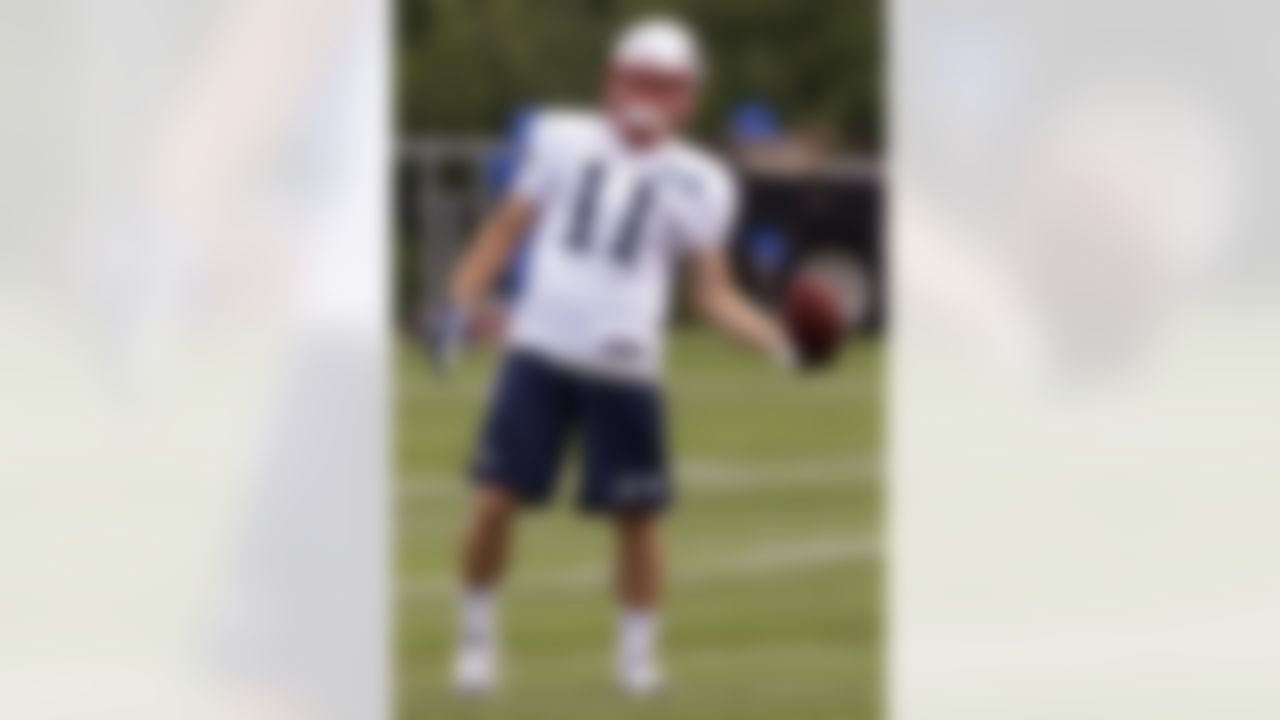 New England Patriots wide receiver Julian Edelman (11) practices one-handed catches during the second day of NFL football training camp in Foxborough, Mass., Friday, July 27, 2012. (AP Photo/Stephan Savoia)