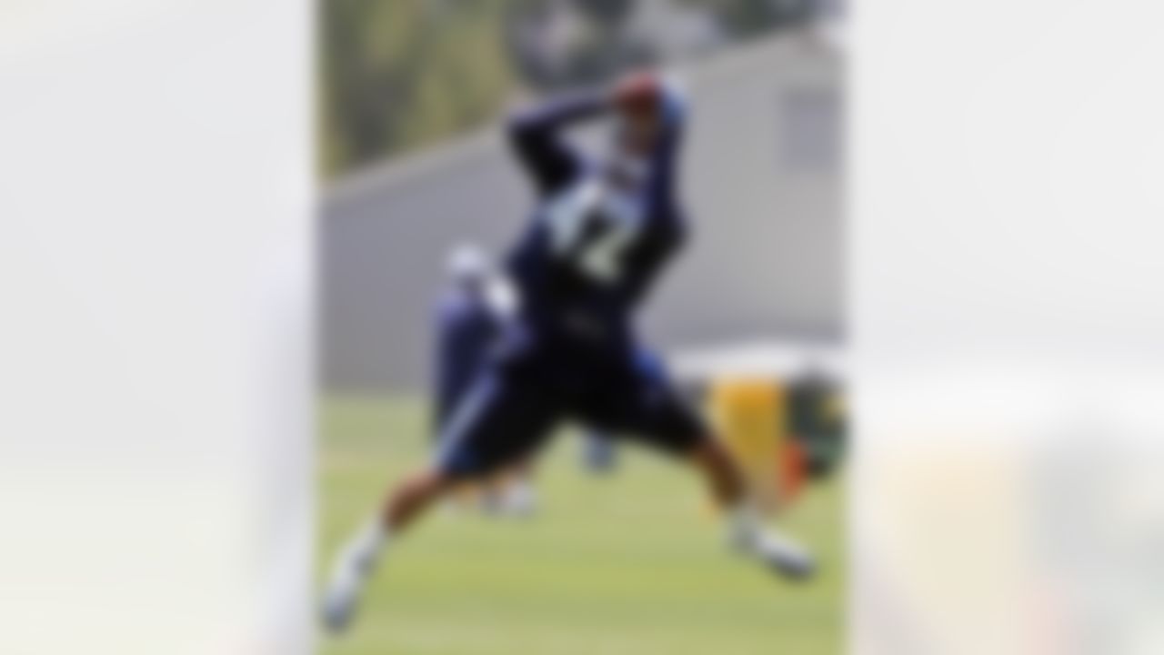 San Diego Chargers defensive back Sean Cattouse makes a catch during NFL football practice at the team's training camp, Tuesday, July 24, 2012 in San Diego. (AP Photo/Lenny Ignelzi)