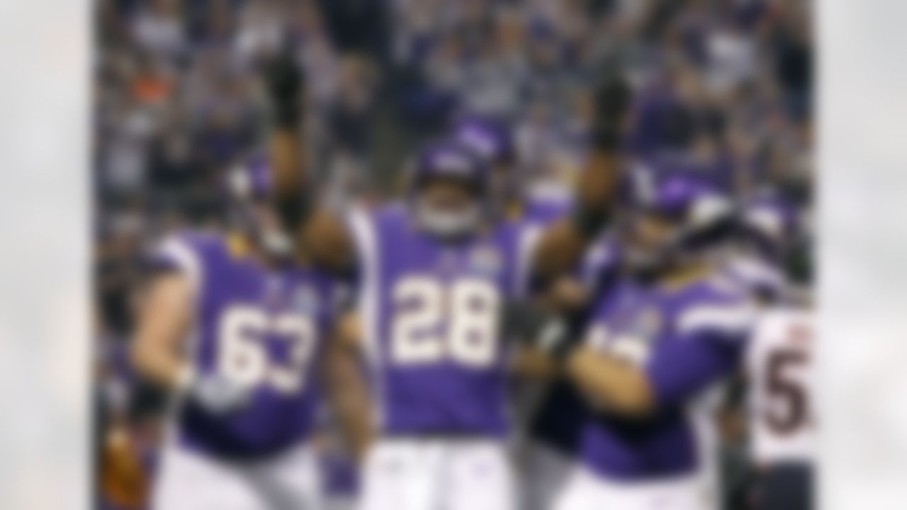 FILE - In this Dec. 9, 2012, file photo, Minnesota Vikings running back Adrian Peterson (28) celebrates with teammate Jerome Felton, right, after scoring on a 1-yard touchdown run during the first half of an NFL football game against the Chicago Bears in Minneapolis. Adrian Peterson avoided jail time on Tuesday, Nov. 4, 2014, in a plea agreement reached with prosecutors to resolve his child abuse case. (AP Photo/Genevieve Ross, File)