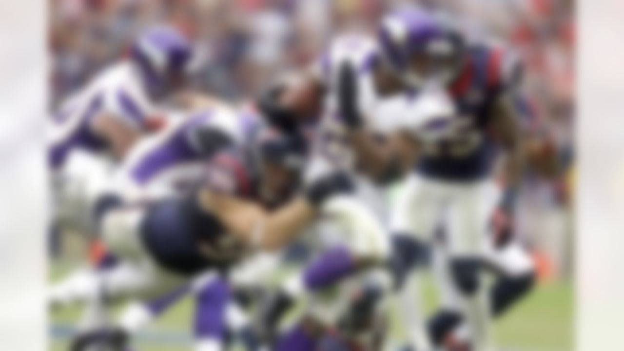 Adrian Peterson tries to turn upfield as the Houston Texans' Connor Barwin (98) tackles him in a 2012 game. (AP Photo/Patric Schneider)