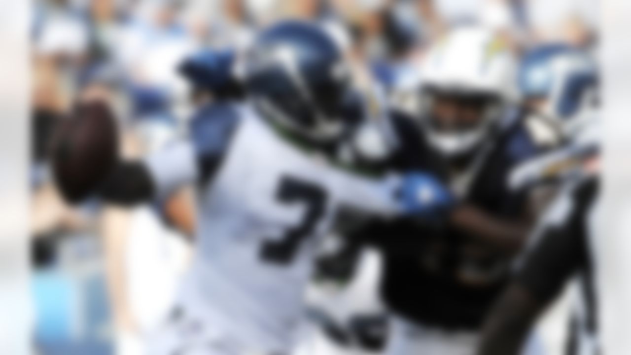Seattle Seahawks quarterback Tarvaris Jackson, left, is sacked by San Diego Chargers linebacker Darryl Gamble during the first half of their preseason NFL football game at Qualcomm Stadium, Thursday, Aug. 11, 2011, in San Diego. (AP Photo/Denis Poroy)
