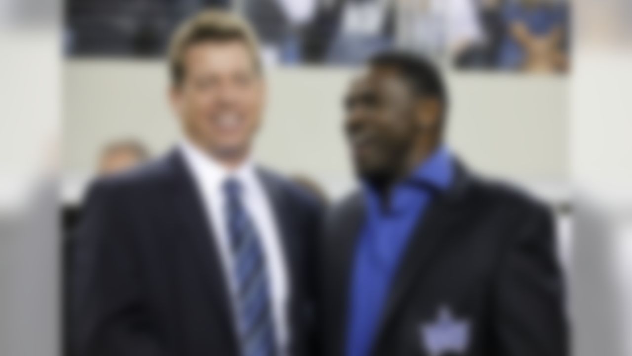 Former Dallas Cowboys Troy Aikman, left, and Michael Irvin, right, laugh as they wait to participate in a halftime ceremony during the Cowboys' NFL football game against the New York Giants, Sunday, Sept. 20, 2009, in Arlington, Texas. (AP Photo/Sharon Ellman)