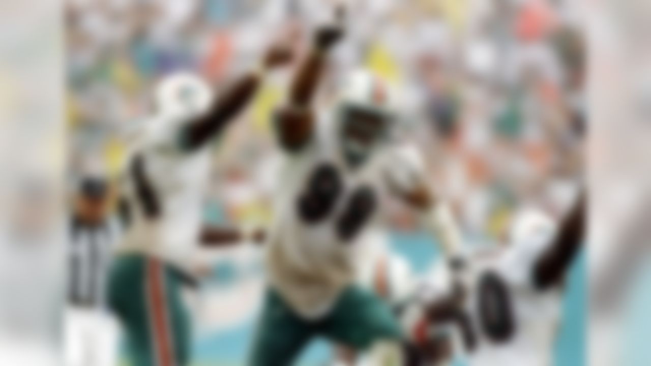 31 Aug 1997:  Defensive lineman Jason Taylor of the Miami Dolphins celebrates during the Dolphins 16-10 win over the Indianapolis Colts at Pro Player Stadium in Miami, Florida. (Photo by Andy Lyons  /Allsport)