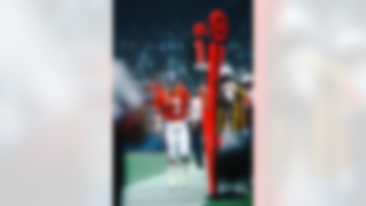 Denver Broncos Hall of Fame quarterback John Elway (7) walks along the sideline during a Super Bowl XXIV NFL game against the San Francisco 49ers in New Orleans, on January 28, 1990. The 49ers defeated the Broncos 55-10. (AP Photo/Eric Lars Bakke)