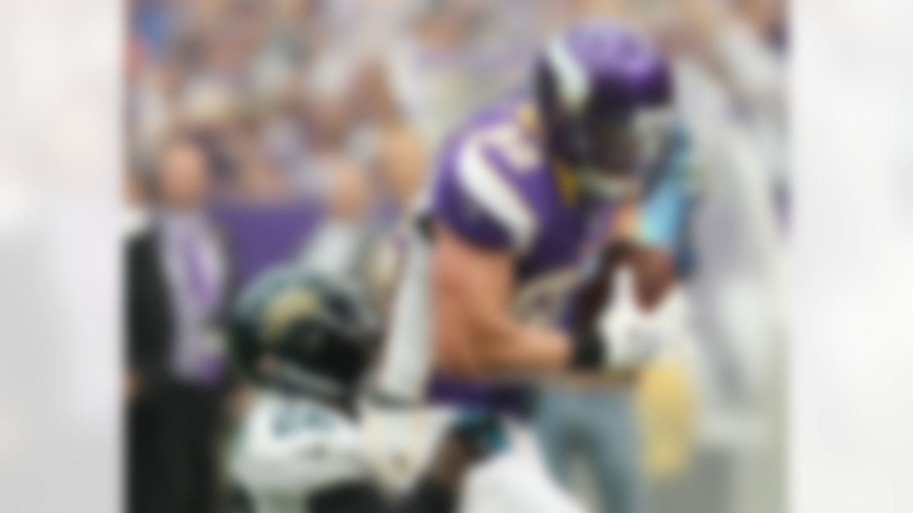Minnesota Vikings tight end Kyle Rudolph, right, catches a pass in front of Jacksonville Jaguars cornerback Kevin Rutland, left, during the second half of an NFL football game Sunday, Sept. 9, 2012, in Minneapolis. (AP Photo/Genevieve Ross)