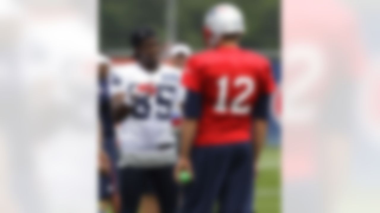 New England Patriots rookie wide receiver Brandon Lloyd (85) talks with quarterback Tom Brady during practice on the second day of NFL football training camp in Foxborough, Mass., Friday, July 27, 2012. (AP Photo/Stephan Savoia)
