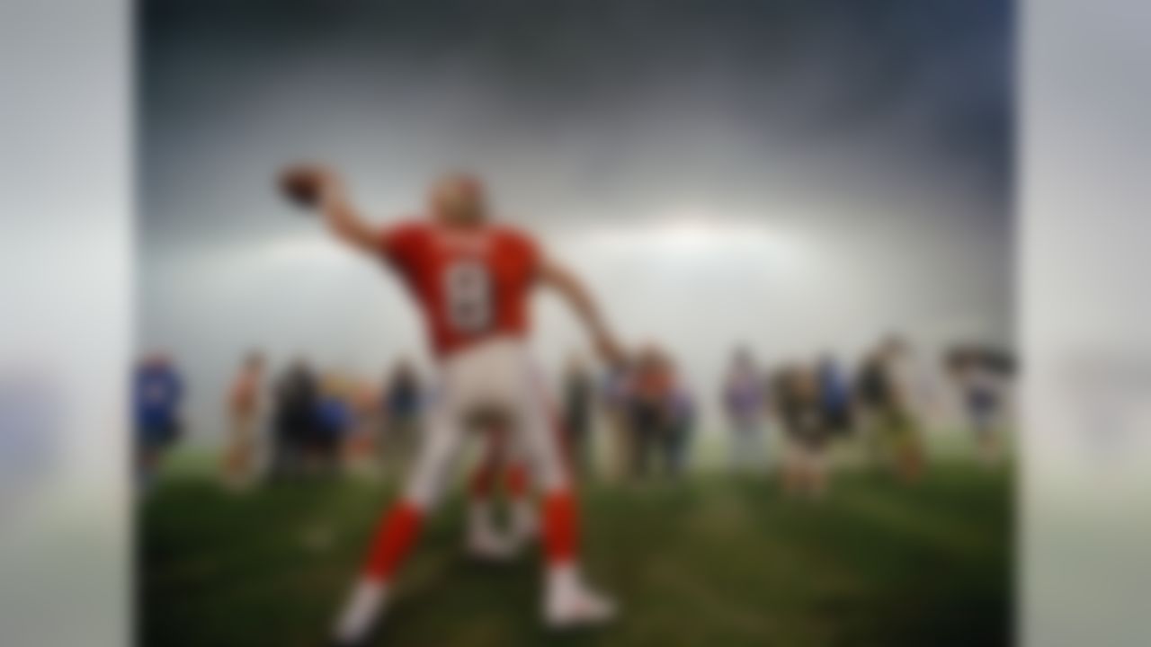 San Francisco 49ers quarterback Steve Young warms up for the second half against the San Diego Chargers following a smoky Indiana Jones-themed halftime show at Super Bowl XXIX in Miami, Jan. 29, 1995. Young, who backed up Joe Montana in two of the 49ers previous Super Bowl wins, had a breakout game, leading all players in passing (325 yards) and rushing (49 yards). He also threw a record six touchdowns, leading the 49ers to a 49-26 win. Young was named MVP. (AP Photo/Ed Reinke)