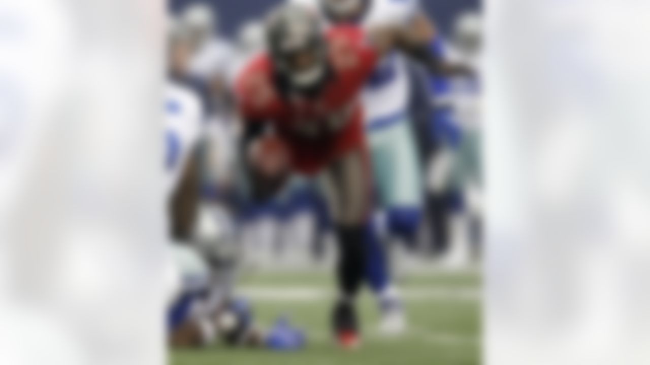 Tampa Bay Buccaneers cornerback Aqib Talib (25) tumbles to the ground after intercepting a pass by Dallas Cowboys quarterback Tony Romo away during the first half of an NFL football game on Sunday, Sept. 23, 2012, in Arlington, Texas. (AP Photo/LM Otero)