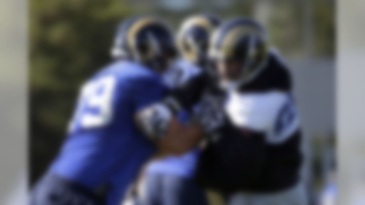 St. Louis Rams defensive end Chris Long, right, tries to get around offensive tackle Rob Havenstein during training camp at the NFL football team's practice facility Tuesday, Aug. 25, 2015, in St. Louis. (AP Photo/Jeff Roberson)