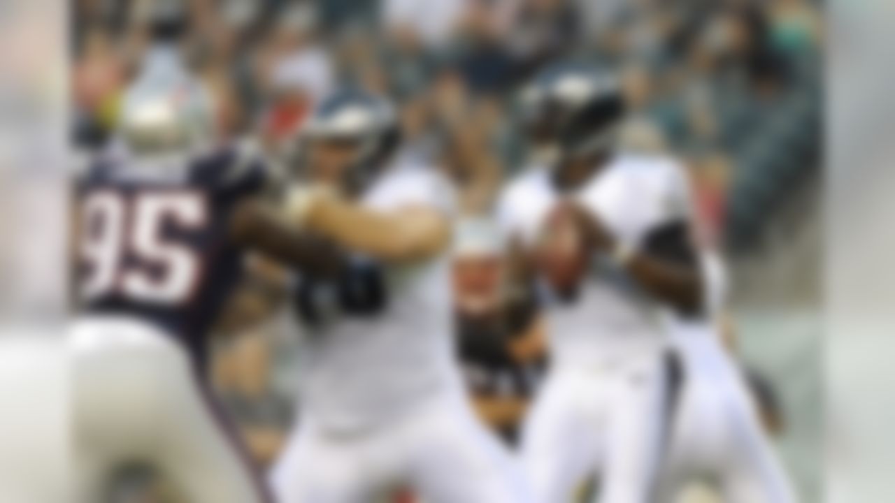 Philadelphia Eagles' Michael Vick looks to pass during the first half of a preseason NFL football game against the New England Patriots, Friday, Aug. 9, 2013, in Philadelphia. (AP Photo/Michael Perez)