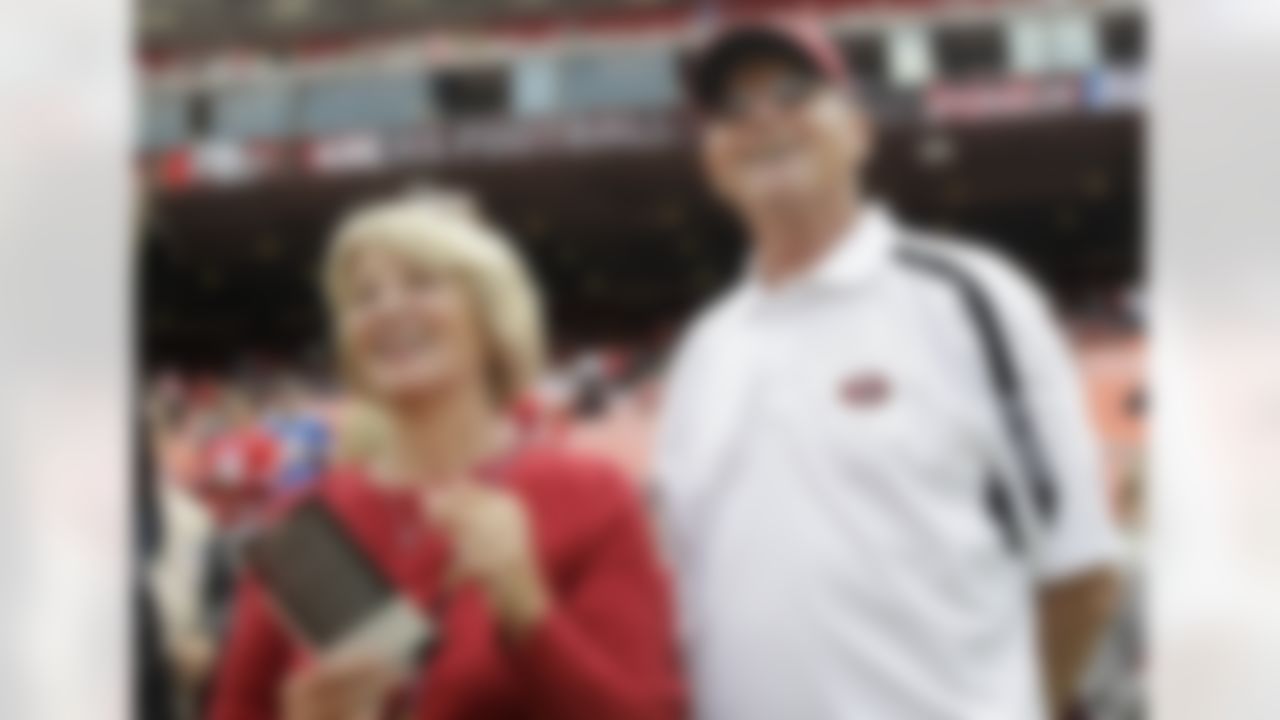 Jackie and Jack Harbaugh, parents of San Francisco 49ers coach Jim Harbaugh, stand before an NFL football game between the 49ers and the Seattle Seahawks in San Francisco, Sunday, Sept. 11, 2011. (AP Photo/Paul Sakuma)