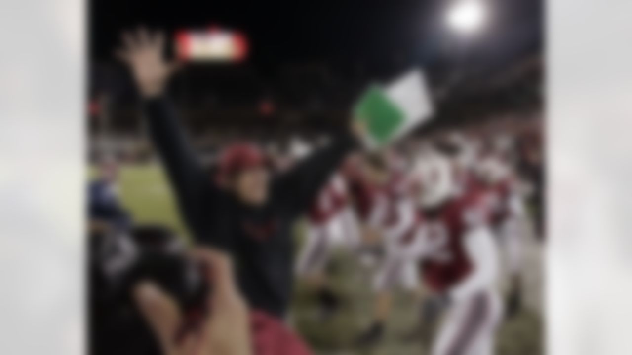 Stanford Cardinal head coach Jim Harbaugh, left, celebrates after Stanford defeated California 20-13 in a college football game in Stanford, Calif., Saturday, Dec. 1, 2007. (AP Photo/Paul Sakuma)