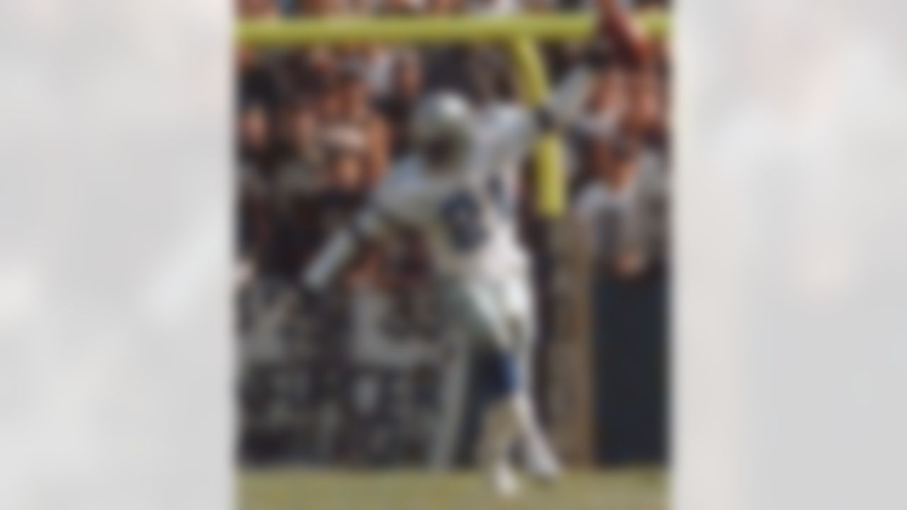 Dallas Cowboys cornerback Deion Sanders flaunts the ball after an interception in the first quarter against the Oakland Raiders at Oakland Coliseum in Oakland, Calif. Sunday, Nov. 19, 1995.(AP Photo/Susan Ragan)