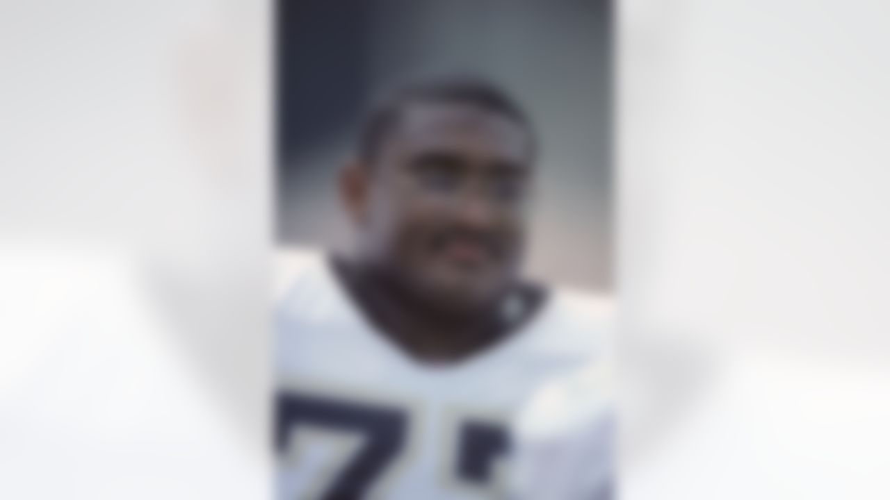 Saints offensive tackle Willie Roaf looks up from the sideline during a preseason game against the Green Bay Packers on August 14, 1993 in Madison,Wis. (AP Photo/Paul Jasienski)