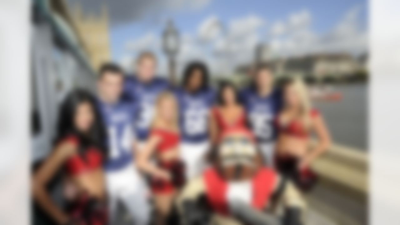 Members of the UK Champion London Blitz pose with Tampa Bay Buccaneer cheerleaders and Buccaneers mascot Captain Fear outside of the Houses of Parliament in London, England, on October 18, 2011. (Dave Shopland/NFL)