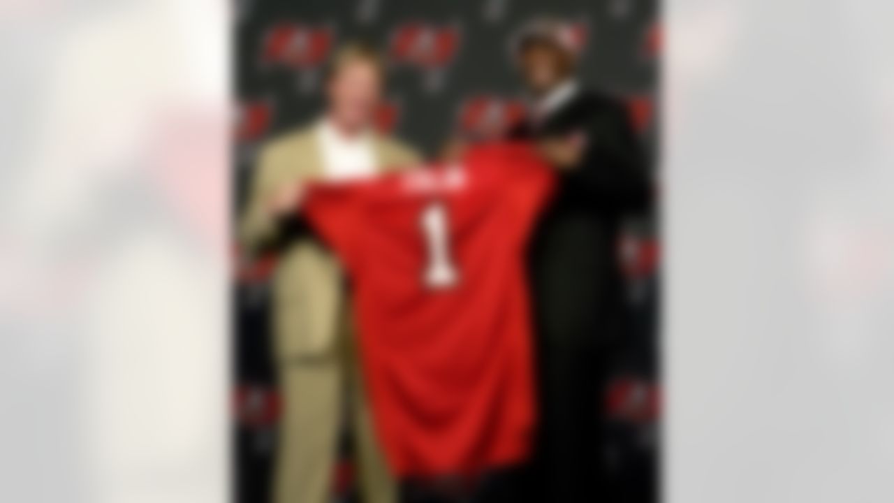 Tampa Bay Buccaneers head coach Jon Gruden, left, and 2008 first-round draft pick Aqib Talib hold up a jersey during a news conference Monday morning April 28, 2008 in Tampa, Fla. Talib played cornerback at Kansas. (AP Photo/Chris O'Meara)