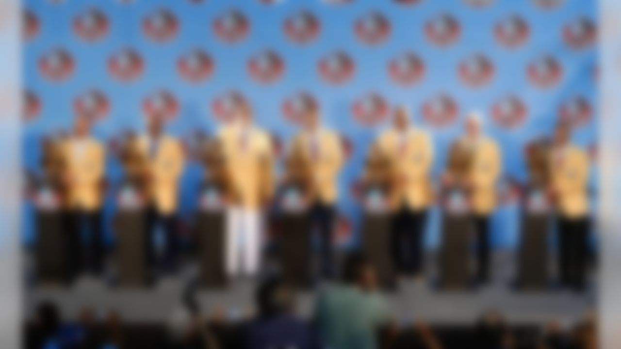 (L-R) Hall of Fame enshrinees Aeneas Williams, Derrick Brooks, Claude Humphrey, Michael Strahan, Walter Jones, Ray Guy, and Andre Reed pose with their busts during the 2014 Pro Football Hall of Fame Enshrinement Ceremony on August 2, 2014 in Canton, OH. (Ben Liebenberg/NFL)