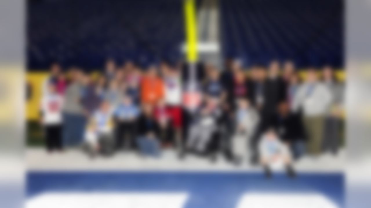 Feb 3, 2012; Indianapolis, IN, USA; Children and their families pose for a group photo during the Make-A-Wish Foundation stadium tour of Lucas Oil Stadium. Mandatory Credit: Dale Zanine-US PRESSWIRE
