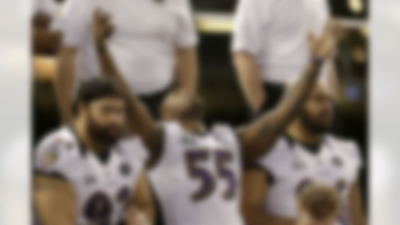 Baltimore Ravens linebacker Terrell Suggs (55) reacts during the team photo at media day for the NFL Super Bowl XLVII football game Tuesday, Jan. 29, 2013, in New Orleans. (AP Photo/Mark Humphrey)