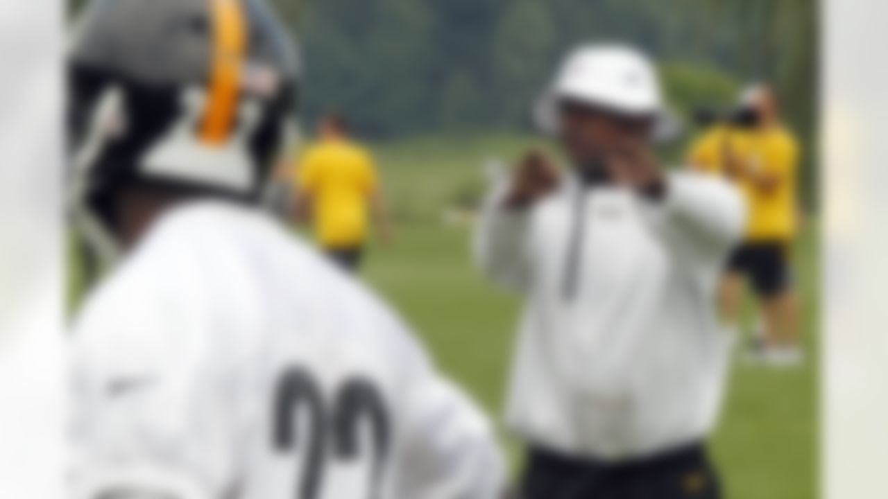 Pittsburgh Steelers running backs coach Kirby Wilson, right, instructs players during practice at the NFL football training camp in Latrobe, Pa., Thursday, July 26, 2012. (AP Photo/Keith Srakocic)