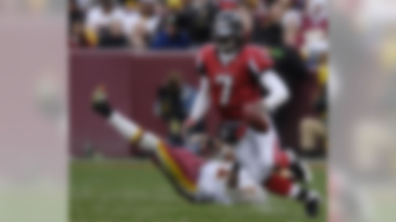 Atlanta Falcons quarterback Michael Vick (7)scrambles against the Washington Redskins during an NFL football game, Sunday, Dec. 3, 2006, in Landover, Md. The Falcons won 24-14.(AP Photo/Nick Wass)