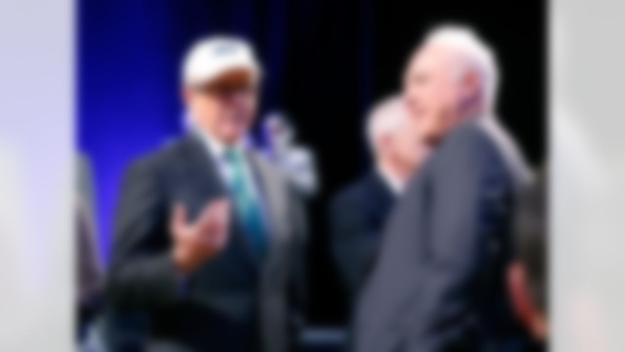New York Jets owner Woody Johnson speaks with Philadelphia Eagles owner Jeffrey Lurie during NFL Commissioner Roger Goodell's press conference at the Rose Theater on Friday, January 31, 2014 in New York, NY. (Perry Knotts/NFL)