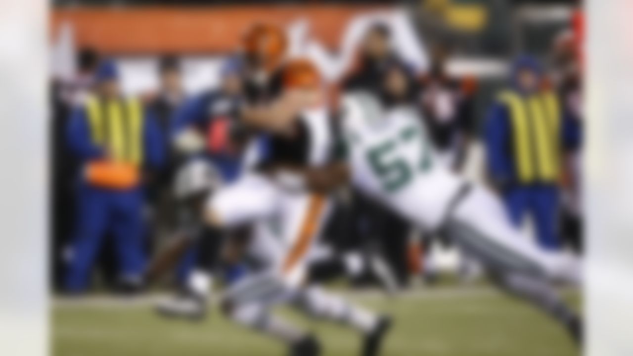 New York Jets linebacker Bart Scott (57) tackles Cincinnati Bengals running back Brian Leonard (40) during the AFC Wild Card Playoff game at Paul Brown Stadium in Cincinnati, Ohio on January 9, 2010. The Jets won 24-14. (Joe Robbins / NFL.com)