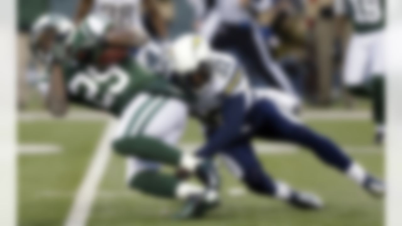 New York Jets running back Bilal Powell (29) is tackled by San Diego Chargers free safety Eric Weddle (32) during the second half of an NFL football game on Sunday, Dec. 23, 2012, in East Rutherford, N.J. The Chargers won 27-17. (AP Photo/Kathy Willens)