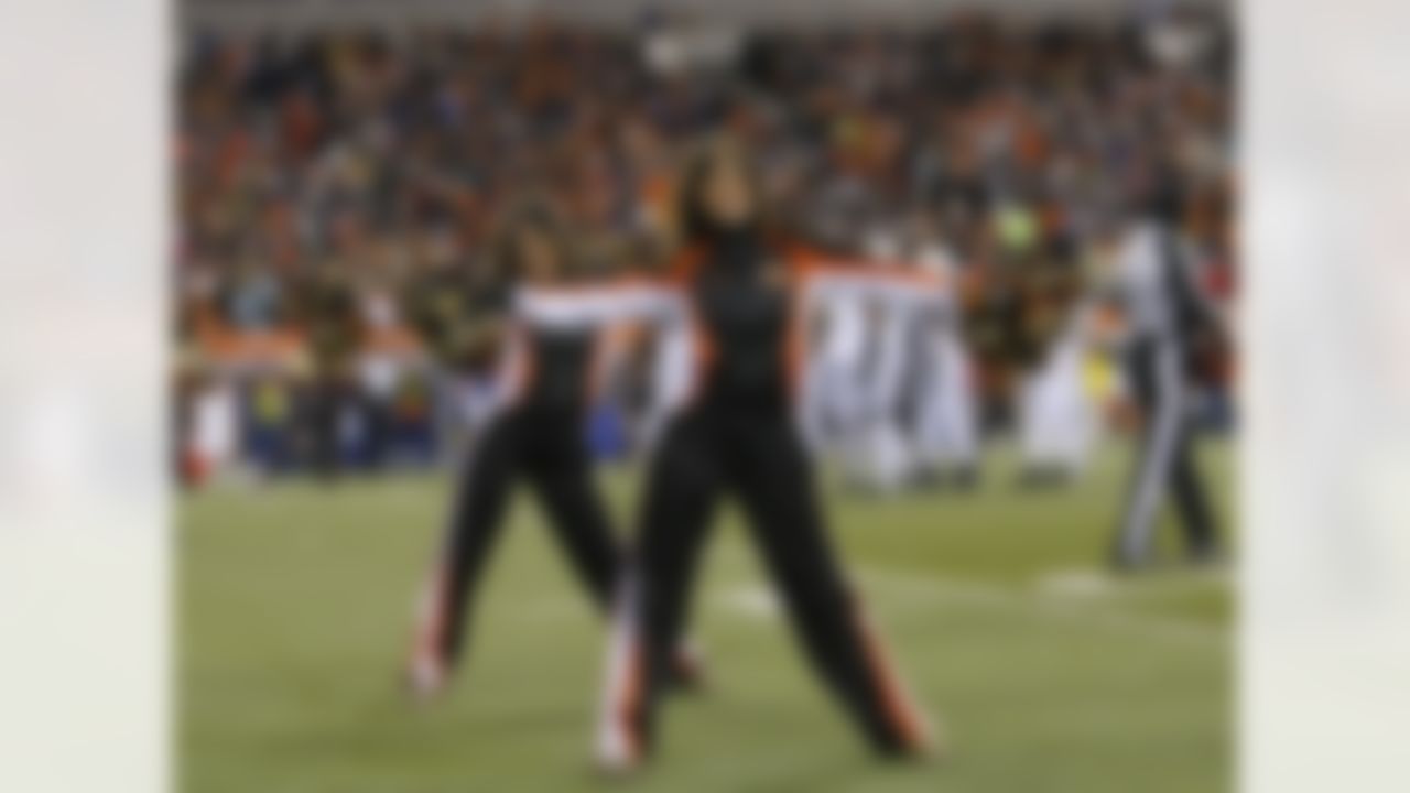 Cincinnati Bengals cheerleaders perform during the second half of an NFL wild-card playoff football game against the New York Jets, Saturday, Jan. 9, 2010, in Cincinnati. (AP Photo/Ed Reinke)