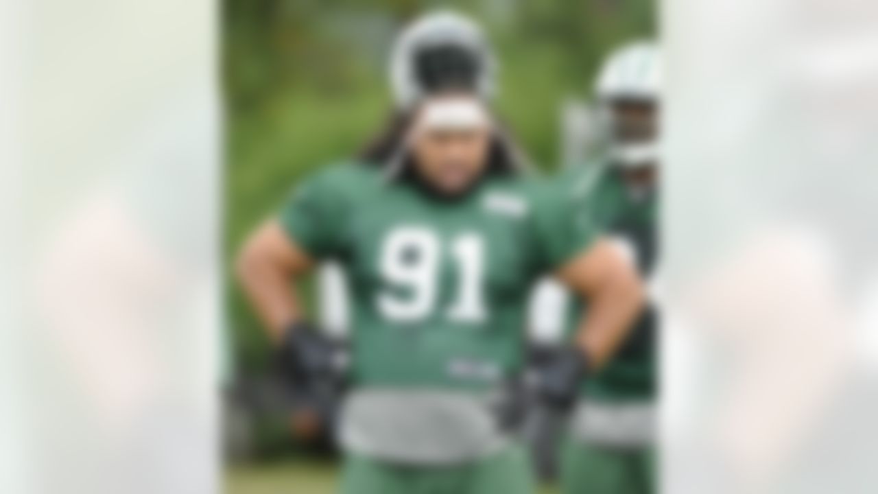 New York Jets defensive tackle Sione Po'uha looks on during practice on opening day of their NFL football training camp Friday, July 27, 2012 in Cortland, N.Y. (AP Photo/Bill Kostroun)