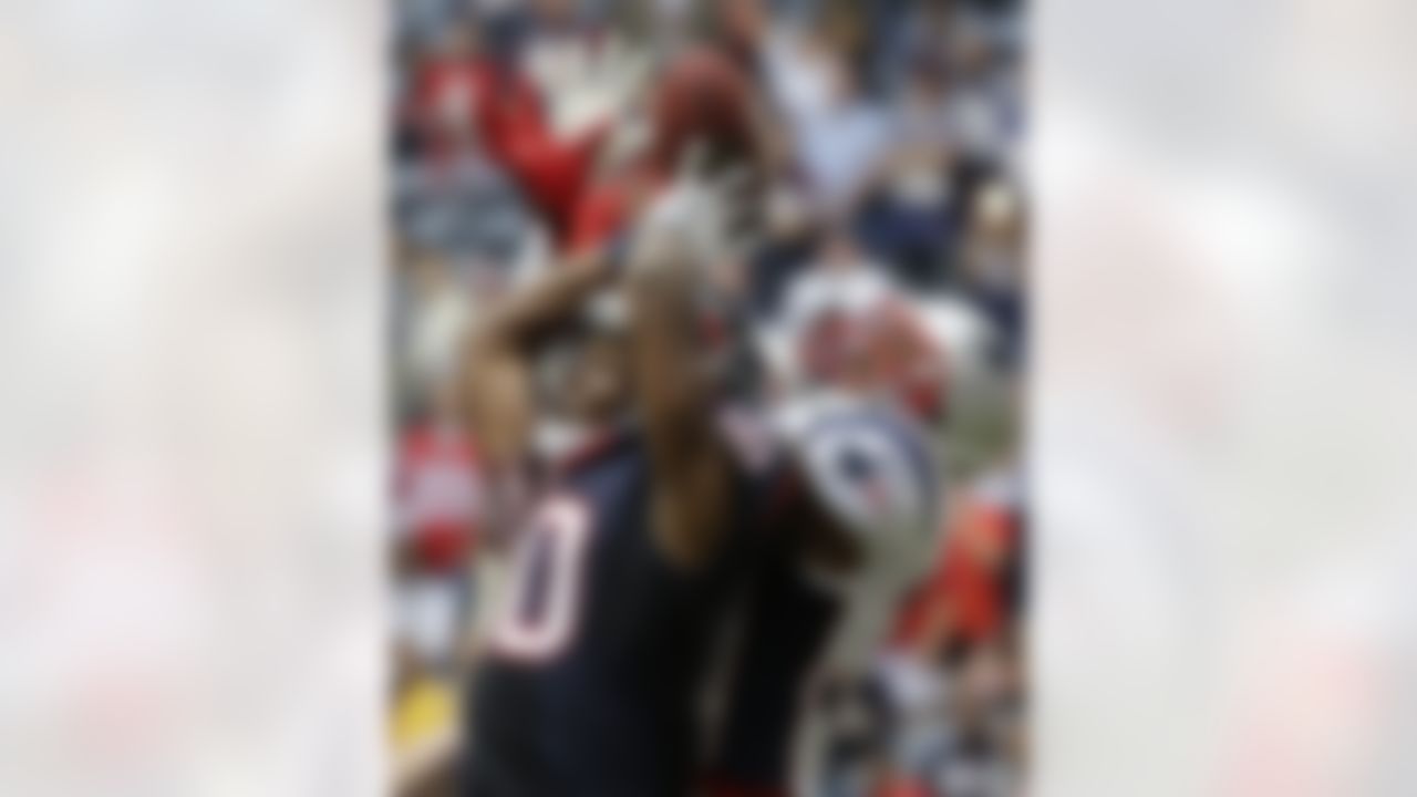 New England Patriots' Aqib Talib, right, breaks up a pass intended for Houston Texans' DeAndre Hopkins (10) during the fourth quarter of an NFL football game Sunday, Dec. 1, 2013, in Houston. (AP Photo/David J. Phillip)