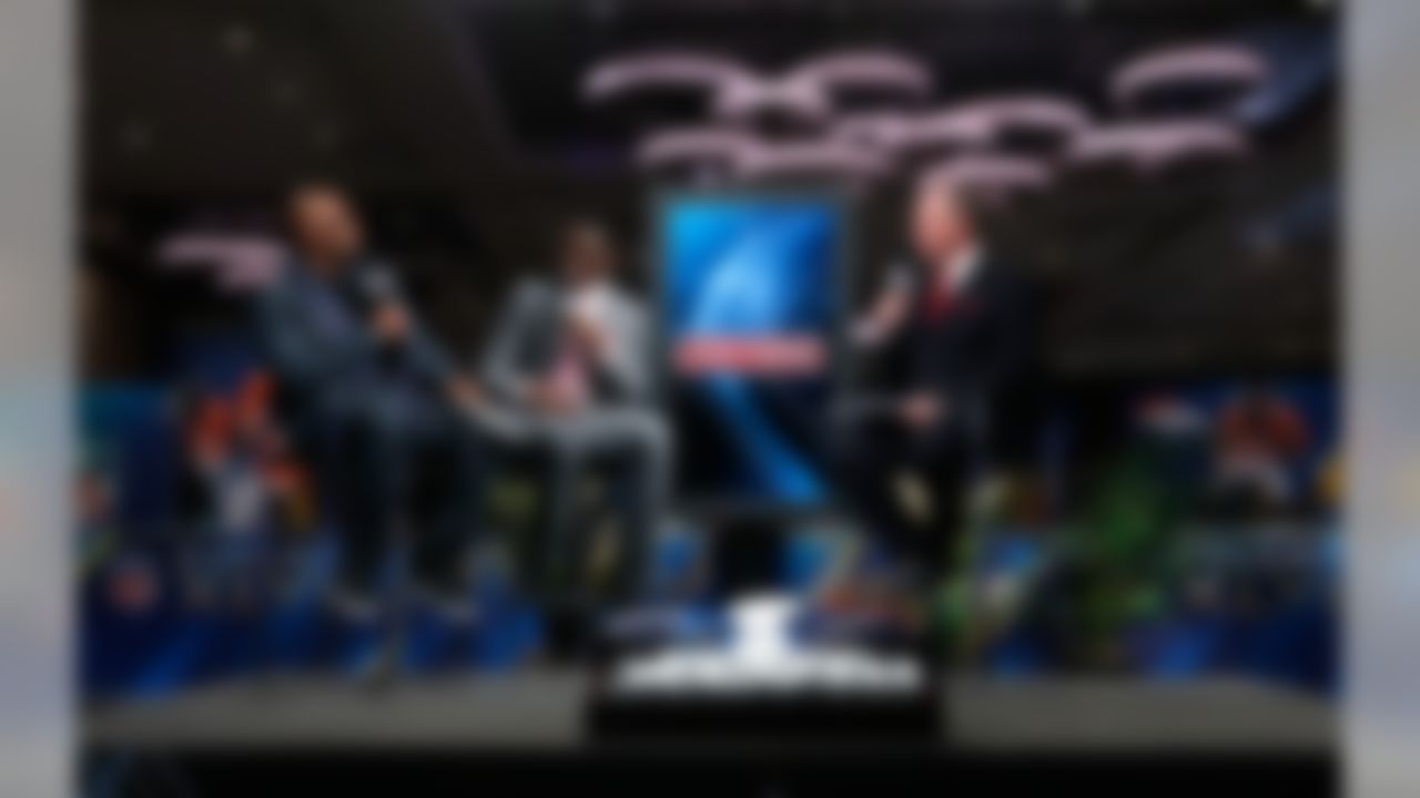 NFL Network's Deion Sanders, Michael Irvin, and Rich Eisen speak on set on Radio Row at the Super Bowl XLVIII media center in the Sheraton Hotel on Wednesday, January 29, 2014 in New York, NY. (Perry Knotts/NFL)