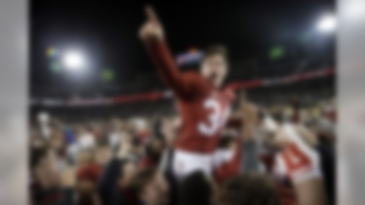 Stanford place kicker Conrad Ukropina (34) is lifted by fans and teammates after hitting a 45-yard field goal as time expired to give Stanford a 38-36 win over Notre Dame in an NCAA college football game Saturday, Nov. 28, 2015, in Stanford, Calif. (AP Photo/Marcio Jose Sanchez)