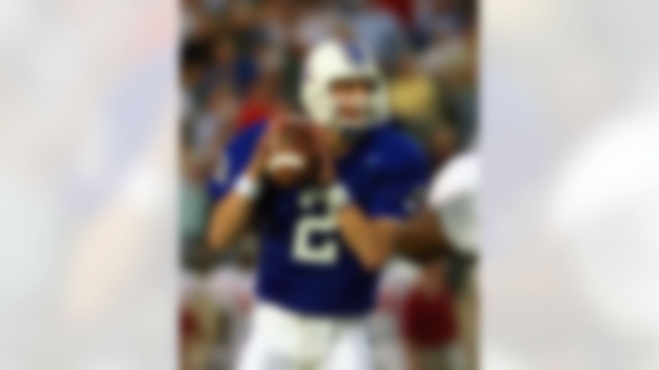 Kentucky quarterback Tim Couch looks for a receiver during the first half of his team's game against Alabama Saturday night, Oct. 4, 1997, in Lexington, Ky. Couch tied a school record for completions in a season during the first half of the game when he threw for his 151st of the year. (AP Photo/Ed Reinke)