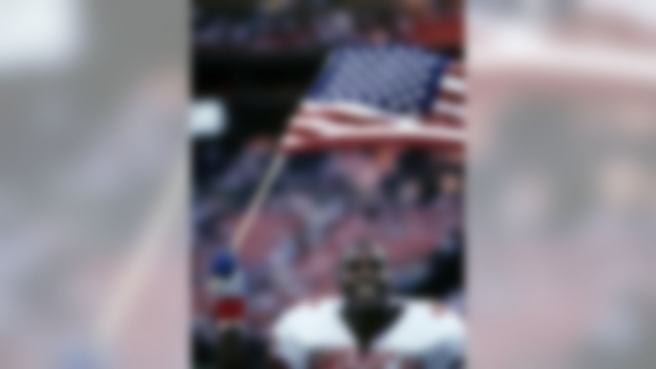 AFC linebacker Derrick Thomas (57) of the Kansas City Chiefs waves an American flag as he leaves the field following the AFC's 23-21 victory over the NFC in the 1991 NFL Pro Bowl played on February 3, 1991 at Aloha Stadium in Honolulu, Hawaii. Photo by NFL/WireImage.com