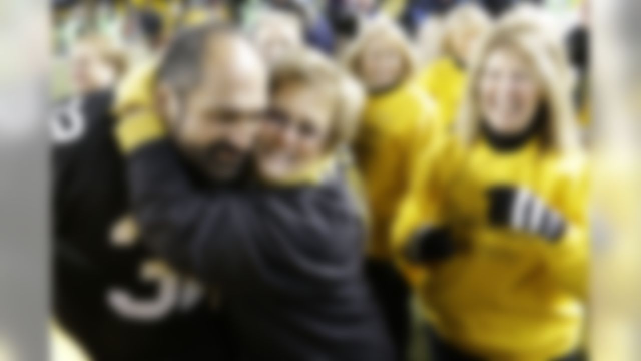 Former Pittsburgh Steelers Hall-of Fame running back Franco Harris greets members of the one time Pittsburgh Steelers cheerleaders, the Steelerettes,  before an NFL football game between the Pittsburgh Steelers and the Cincinnati Bengals on Sunday, Dec. 15, 2013 in Pittsburgh. (AP Photo/Gene J. Puskar)